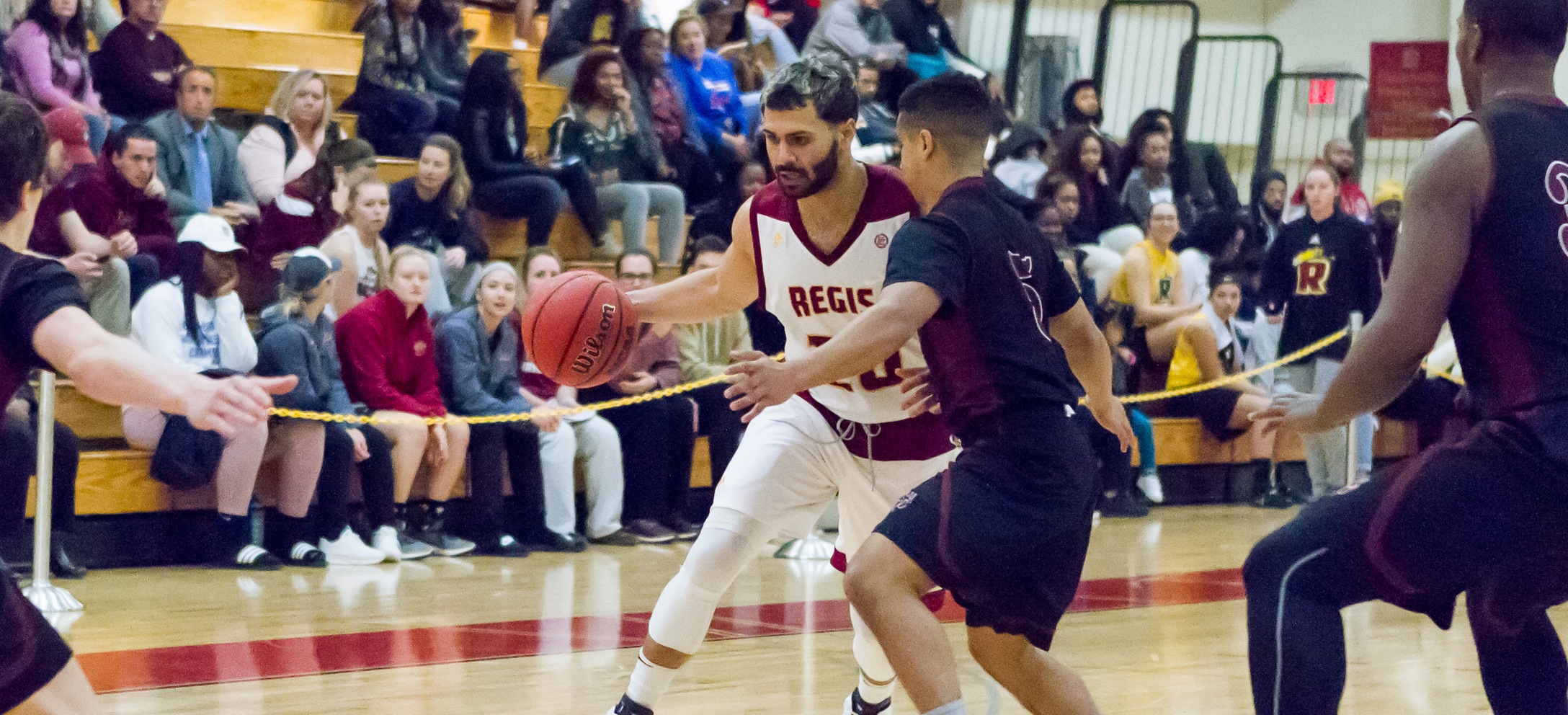 Men's Basketball Rallies For Key Road Win At Suffolk