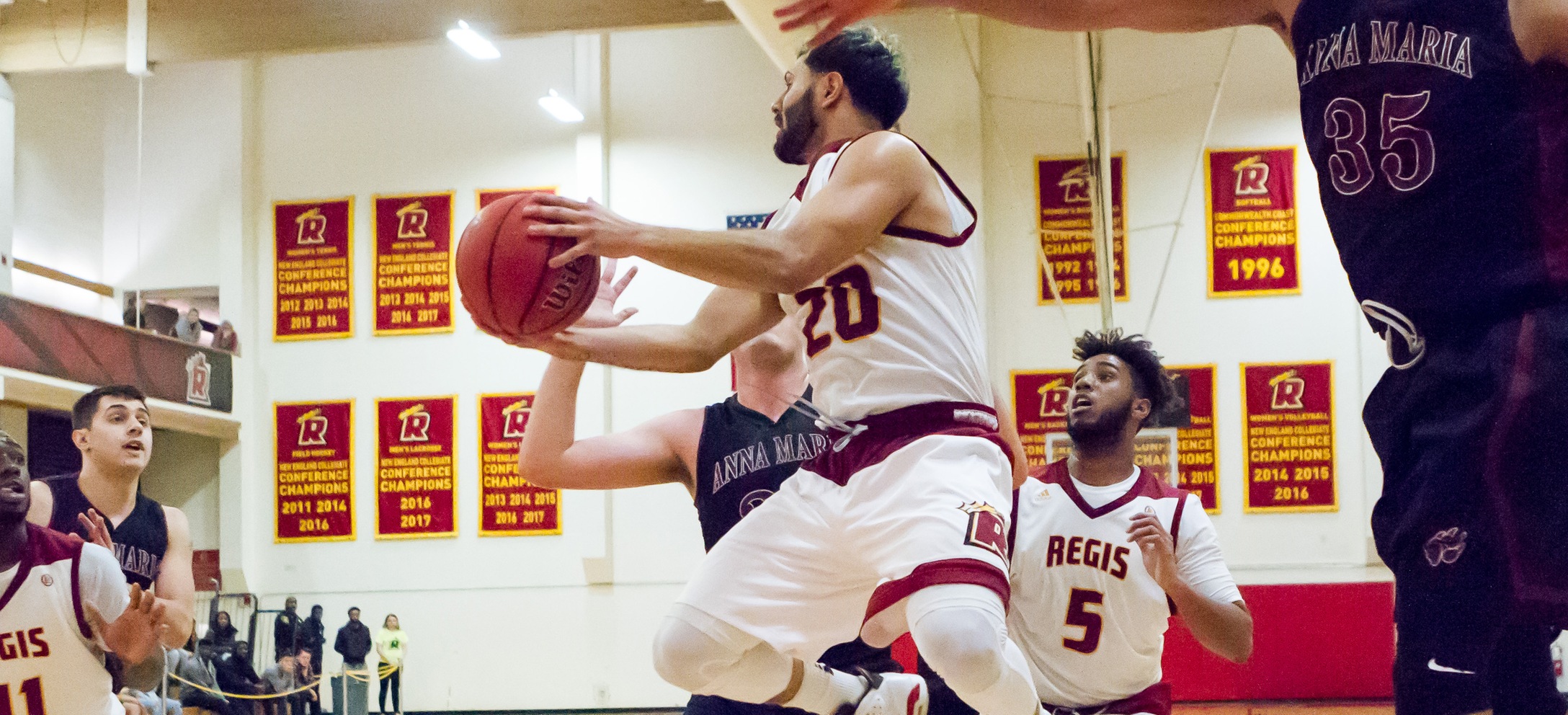 Men's Basketball Holds On For Road Win At Rivier