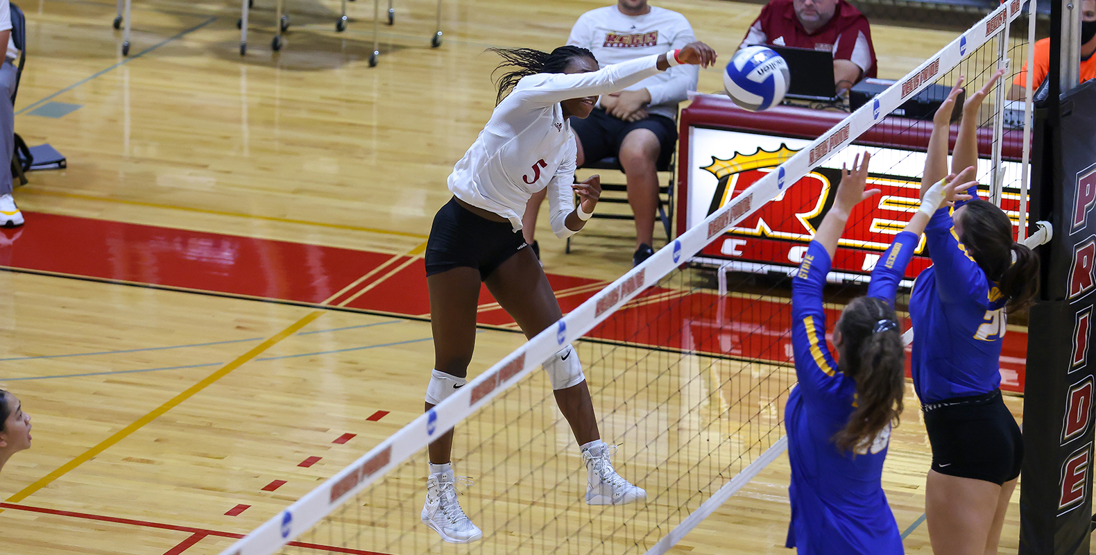 Regis Women’s Volleyball Splits Friday Contests at Bonnie May Invite